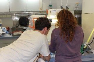 Michael Ottman and Sarah Nicholas from Dr. Brandy Toner's lab at the University of Minnesota, work quickly to process water samples in an ultra-clean manner. 