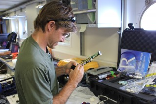 Chief scientist Brian Glazer, calibrates a new ph sensor to put onto the CTD Rosette. 