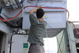 University of Minnesota researcher Michael Ottman puts up the Nitrogen gas tubing for the glove boxes. 