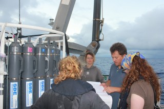 Dr. Olivier Rouxel from the French Research Institute for Exploitation of the Sea (Ifremer) works with the science party to map out the next CTD Rosette. 