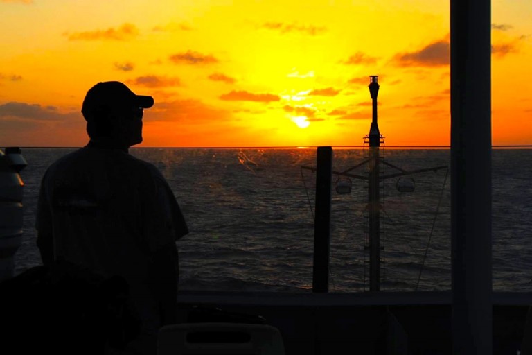 Jason Leonard on whale-spotting duty at sunset. 
