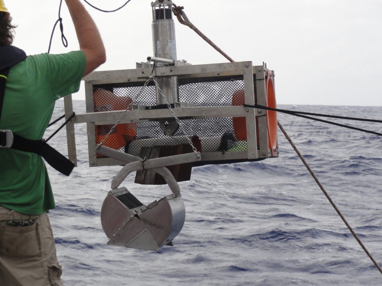 Scientists deploy the Wee Trap from the aft deck. The jaws of the grabber remain open until it hits the sea floor.