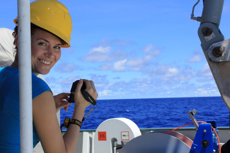 Student opportunity participant Jennifer Killinger filming science on the aft deck. 