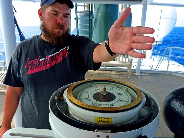 Compasses are a bit easier to work with than stars. Josh Tucker on the upper deck getting a bearing. 