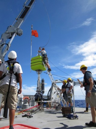 The Rock Grabber lander has a "lollipop" float composed of sytactic foam. In this photo, Senior Bosun Lars Toensfeldt is attaching a cable to the top of the lollipop.