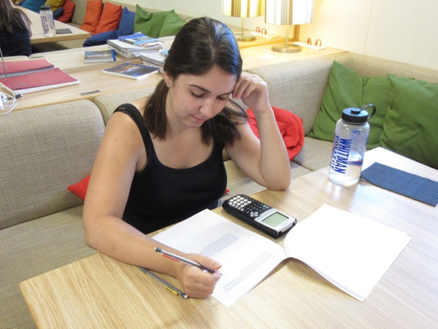 Anna Downing, a student at Whitman College, uses the library to keep up with her studies. Here she is shown taking a test for her genetics class.