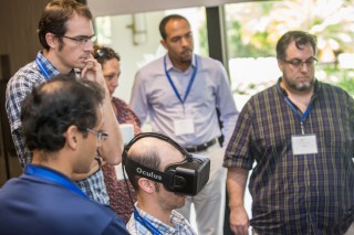 Workshop participants check out a virtual reality demonstration given by Dr. Oliver Kreylos.