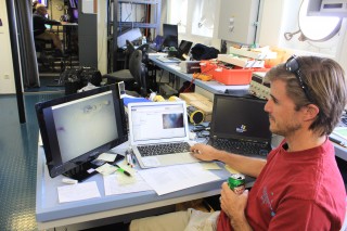 Cheif scientist Dr. Brian Glazer from the University of Hawaii looks at some of the photos taken by AUV Sentry. 