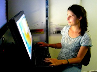 Madi Patterson processing sonar data in Falkor's control room.