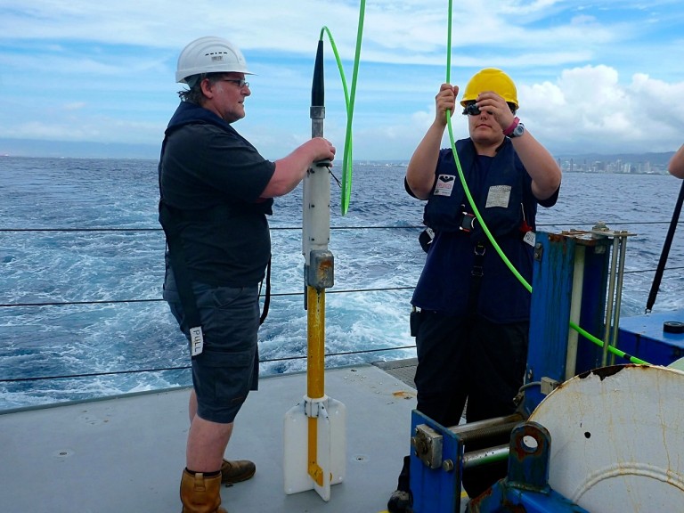 Marine technicians Peter Keen and Colleen Peters deploying the magnetomter during an earlier expedition. 