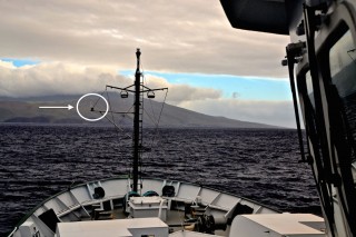 A view of the meterological sensors (circled) on Falkor's bow mast.