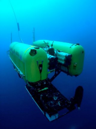 Nereus, WHOI’s novel lightly-tethered, 11,000m-rated ROV. The vehicle is equipped with a single manipulator for seafloor sampling using the same tools developed for the more conventionally-tethered 6500m-rated Jason ROV. 