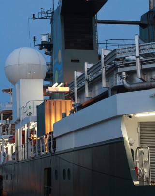 Research vessel Falkor in port at St. Petersburg at night.