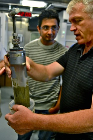 Andre Droxler (right) and Pankaj Khanna checking out one of several sediment cores collected with the ROV.