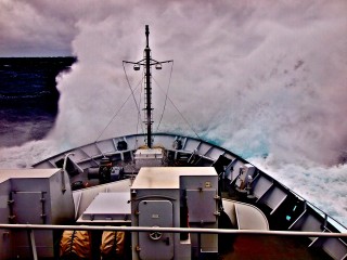 A wall of water as Falkor hits another wave.