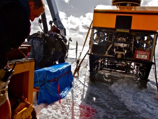 A wave washes across the aft deck.