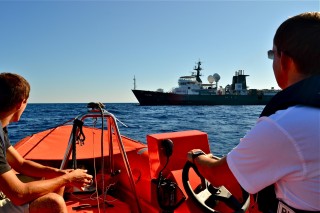 Tom Bills (right) and Kyrylo Ierofieiev (left) from the Falkor crew helping to test the system that allows for electronic communications between the ship and the ROV.