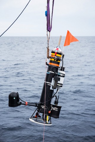 Lagrangian Float is lowered from Falkor’s aft deck into the water. Photo credit: