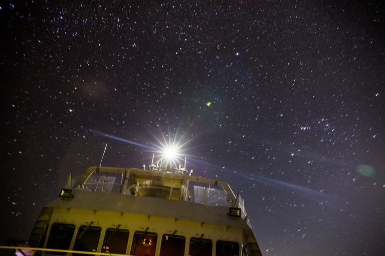 A long exposure shows the stars over Falkor’s bridge as the ship makes its way through the night.