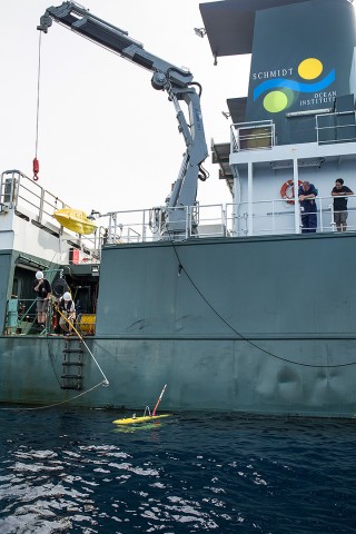 Kaarel Rais Deck Cadet prepare to retrieve AUV Sirius after a mission. This is accomplished by using poles to attach lines to it via poles then lifting the vehicle on deck via crane. 