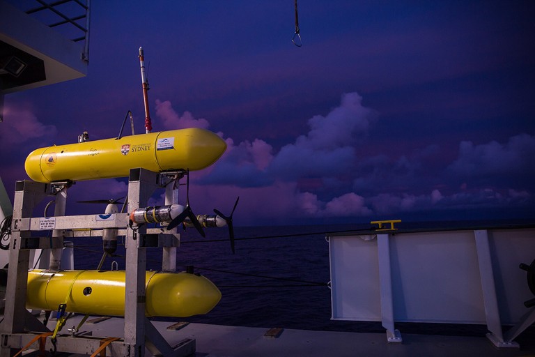 A brilliant sunset behind Sirius A brilliant sunset behind AUV Sirius as it sits on the aft deck of Falkor.