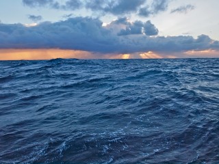 Sunrise over rough seas. 