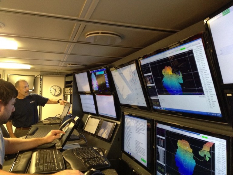 Dr. Sager in the control room showing his student scientists what to watch for as we map the ocean floor. 