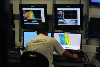 Florida State University PhD student Mauricio Silva-Aguilera works to prepare dive site maps. 